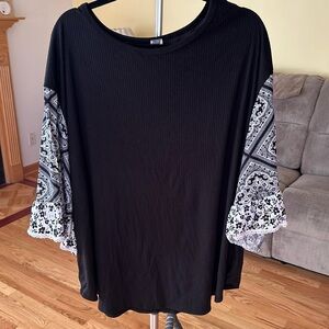 Honey me Curvy black top.  Three-quarters of sleeve black knit top.